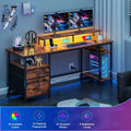 Scrivania angolare a L marrone per gaming e ufficio, 130 cm, 1 persona, con luci LED, schedario e prese di corrente